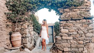 Standing under an arch in Italy